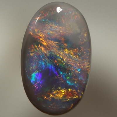 SOLID BLACK OPAL Bright reds over blue with orange and green